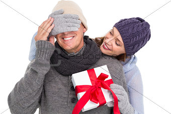 Woman surprising husband with gift