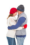 Happy couple in warm clothing hugging