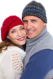 Happy couple in warm clothing hugging