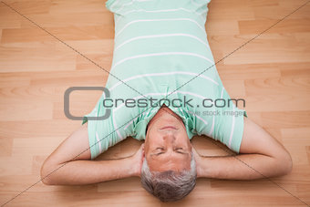 Mature man lying on floor