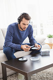 Young man listening to cds