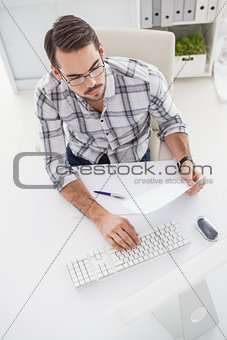 Casual businessman using his computer
