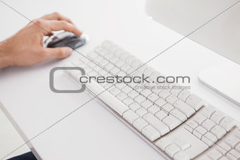 Businessman using the computer mouse