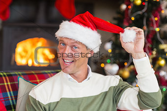 Smiling man wearing santa hat