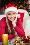 Happy blonde woman in santa hat