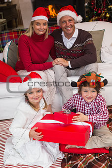 Family in santa hats celebrating christmas