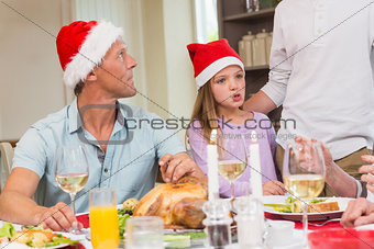 Father and daughter in santa hat at christmas time