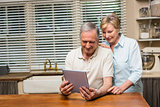 Senior couple looking at tablet pc together