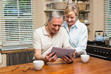 Senior couple looking at tablet pc together