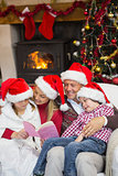 Happy family reading at christmas