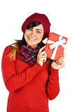 Brunette in red hat holding a gift