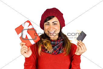 Happy brunette holding gift and cards