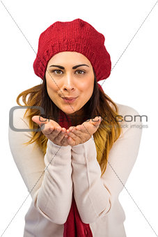 Brunette in winter clothes with hands out