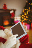 Father christmas touching tablet pc