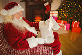 Santa claus reading his list at christmas