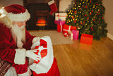 Santa claus stocking gifts at christmas