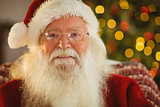 Portrait of smiling santa with his glasses