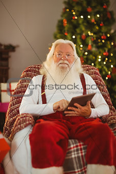 Happy santa using tablet pc