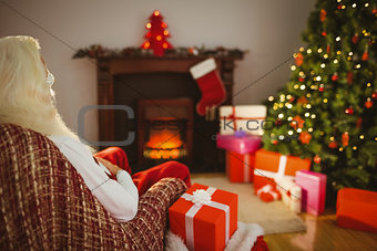 Santa claus sitting on the armchair