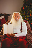 Portrait of santa showing his book
