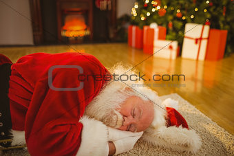 Father christmas sleeping on the rug