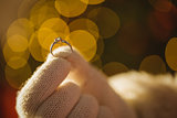 Close up of santa holding engagement ring