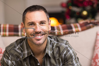Smiling man smiling at christmas