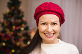 Portrait of a smiling brunette in red hat