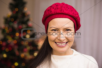 Portrait of a smiling brunette in red hat