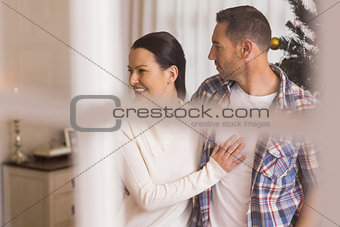 Love couple cuddling and looking away