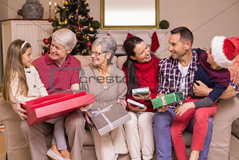 Festive family opening gifts at christmas