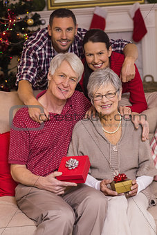 Happy family posing with presents
