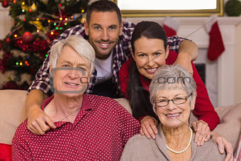 Smiling family posing at christmas