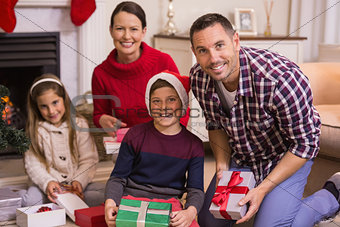 Portrait of smiling family celebrating christmas