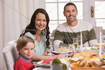 Smiling family during christmas dinner