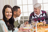 Smiling woman during christmas dinner