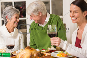 Senior couple laughing at christmas dinner
