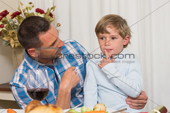 Father with his son sitting on lap