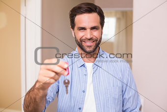 Casual man showing his house key