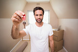 Casual man showing his house key