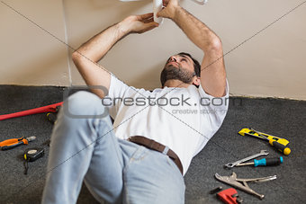 Plumber fixing the sink in a bathroom