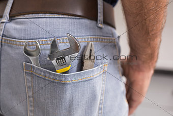 Handyman with tools in back pocket