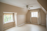 Empty master bedroom in cream and beige