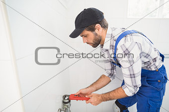 Plumber fixing tap with wrench