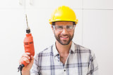 Construction worker holding power drill