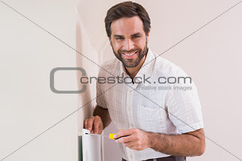 Handyman hanging up a radiator