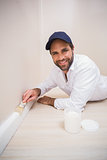 Painter painting the skirting boards