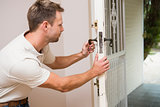 Handyman testing the door handle