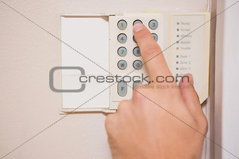 Man arming a home alarm