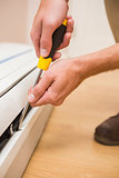 Handyman fixing an air conditioning